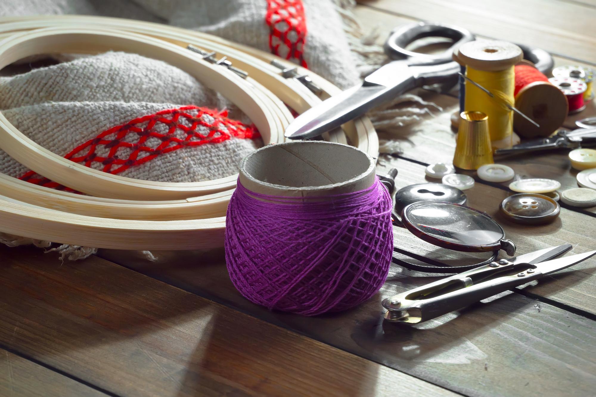 Workspace with embroidery tools and silk threads